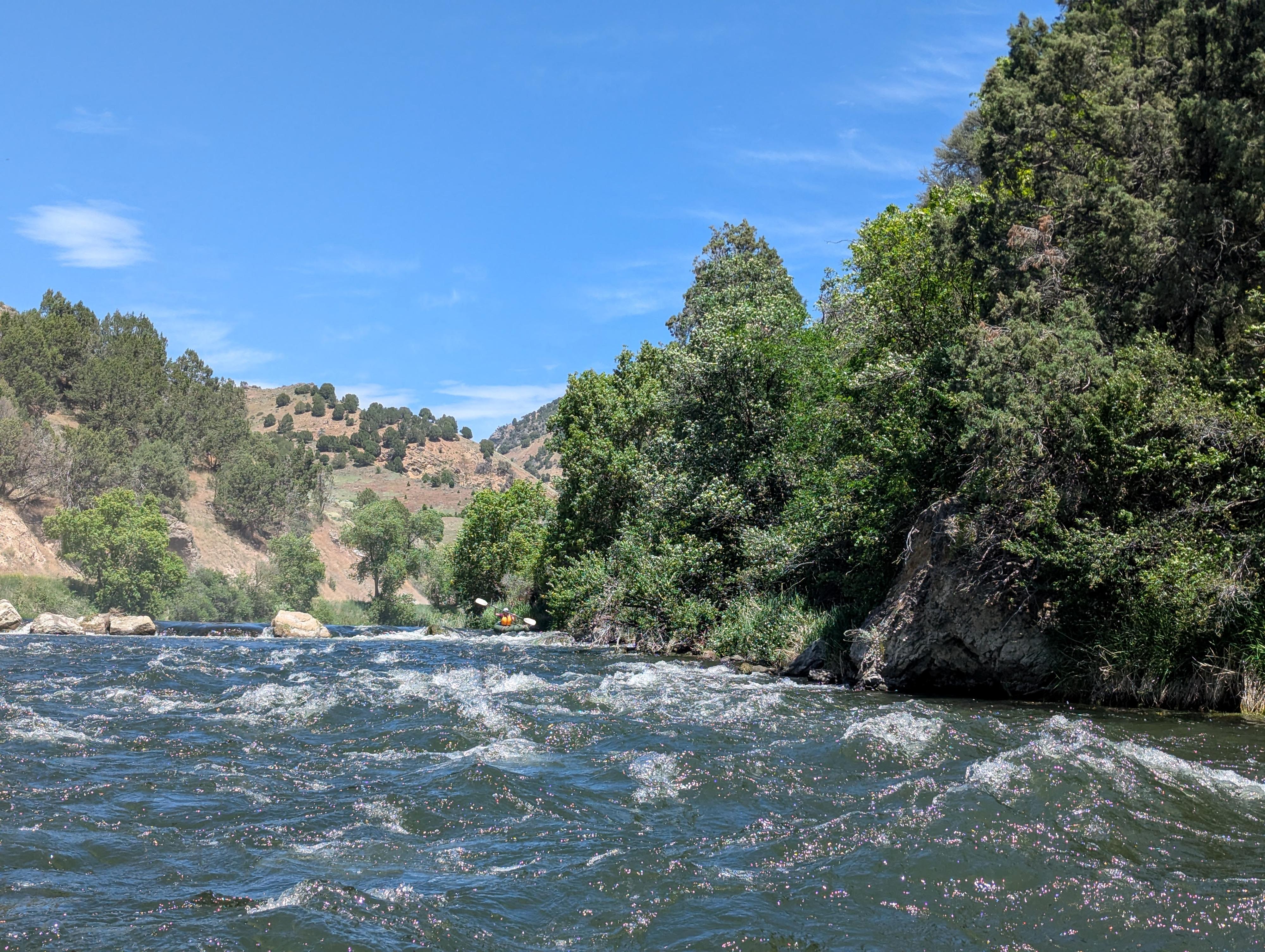 Diane in the packraft at the Diversion Dam below the usual takeout. 