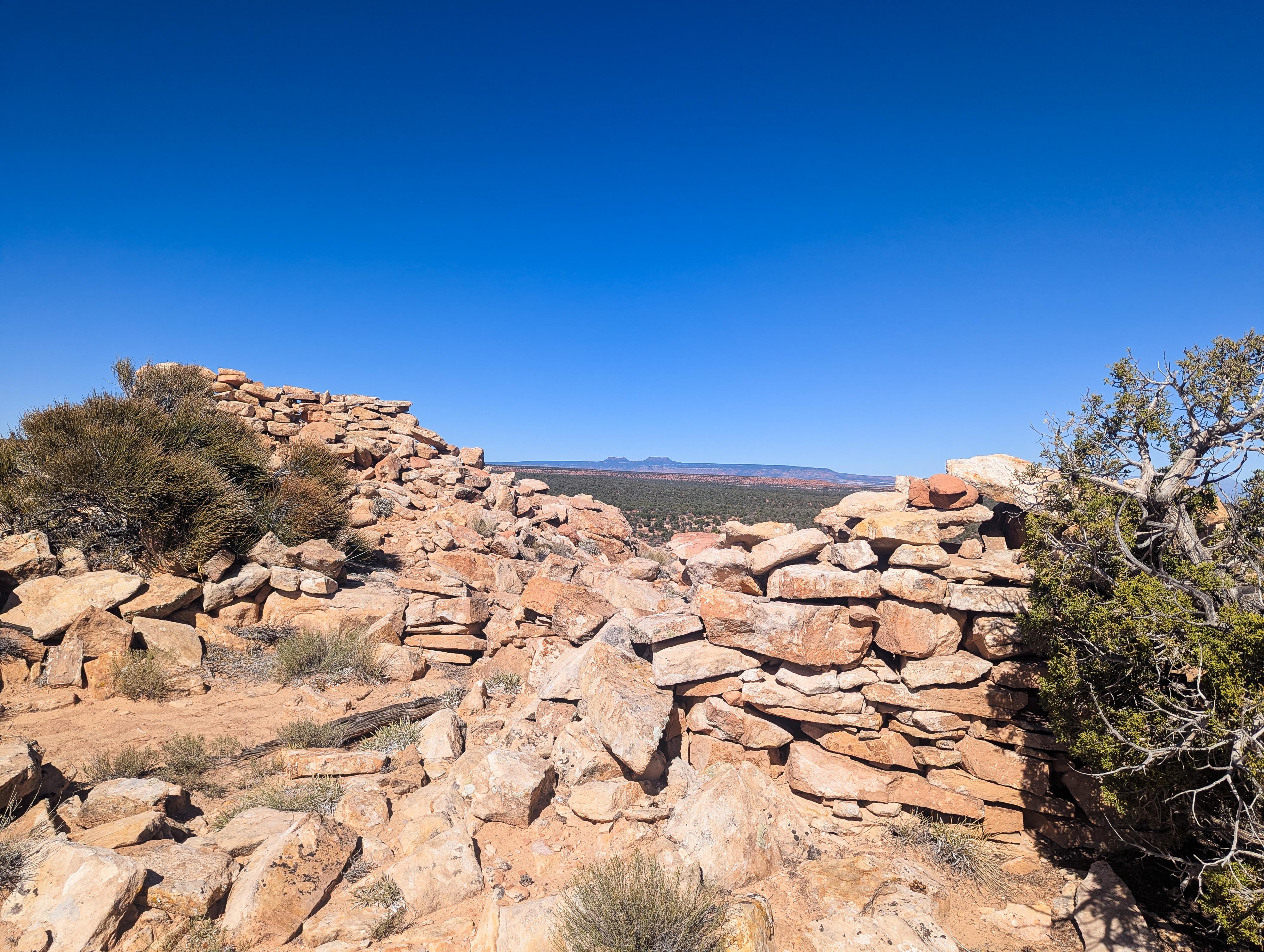 The Bears Ears framed between the ruins.