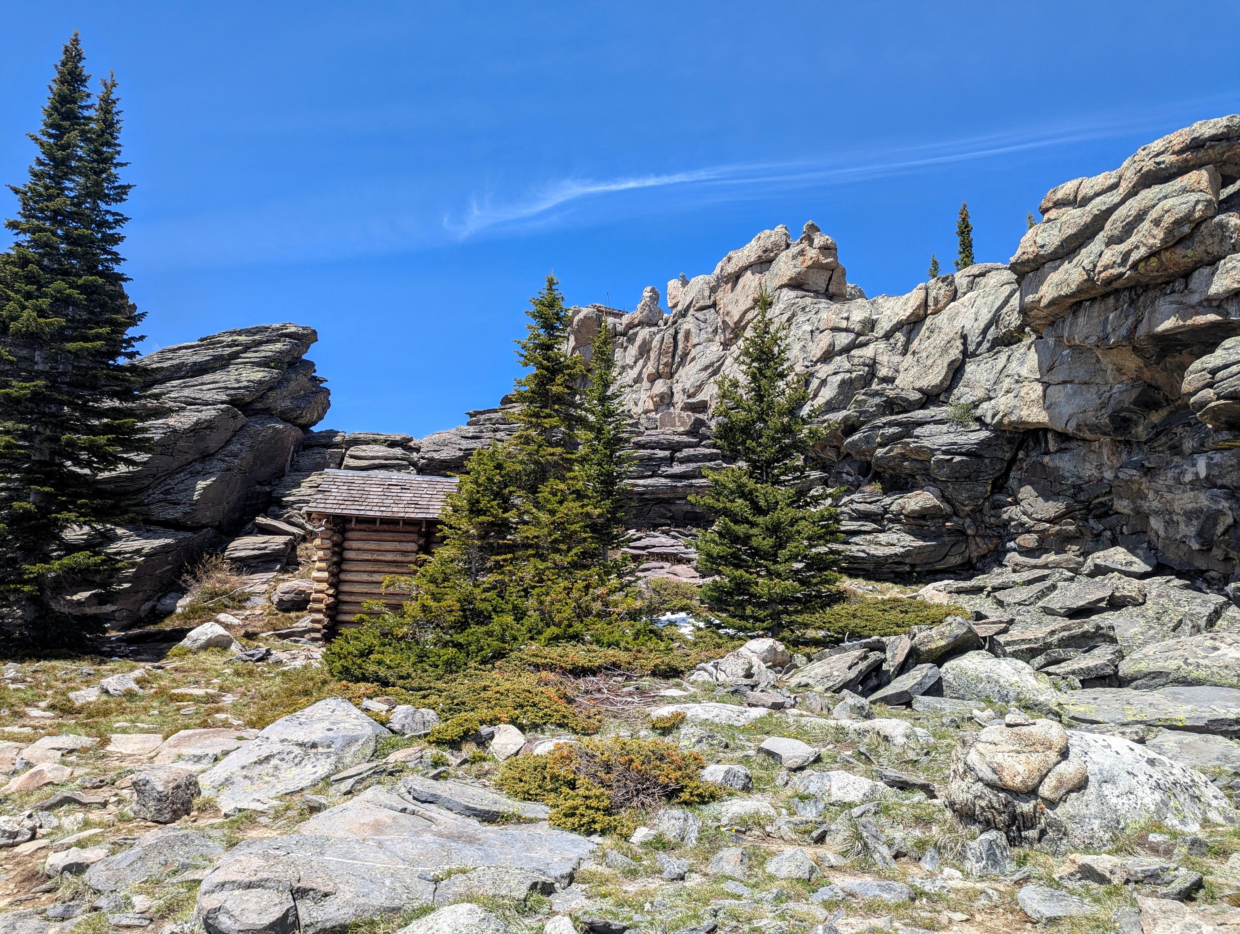 The ridge behind the outhouse. The lookout tower it top center, but not really visible in the photo. 