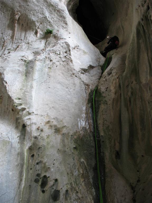 Rappel toward the end of the cave