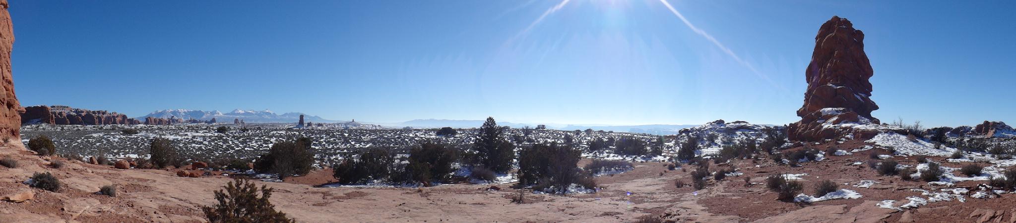 Winter panorama from behind Balanced Rock. The La Sal Mountains and Windows in the background.